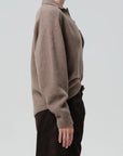 Agatha Rugby sweater by Citizens Of Humanity/AGOLDE in dark tones, side view styled with matching dark pants.