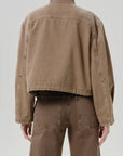 Tan Citizens Of Humanity funnel collar barn jacket and matching brown pants, back view.