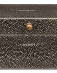 The Gatsburg Shagreen Box by Sarreid is a rectangular black storage box featuring a dotted pebble-textured surface and a small round brass knob at the front center, shown against a white background.