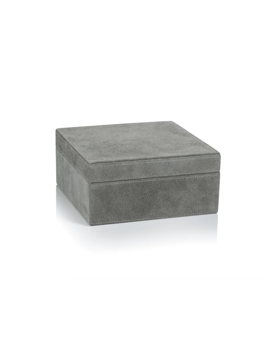 A simple rectangular grey velvet Zodax Suede Lux Box on a white background in a Scottsdale Arizona bungalow.