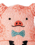 The Faire Pig Embroidery Kit includes pink fabric, black stitched eyes, a detailed snout, and a teal bow tie—ideal for beginner embroidery fans or anyone looking to create a plush pig toy.