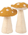 The Faire Mushroom Critter features two plush felt mushrooms with cream stems and yellow-brown caps adorned with white spots—an adorable cottagecore decor piece for your home.