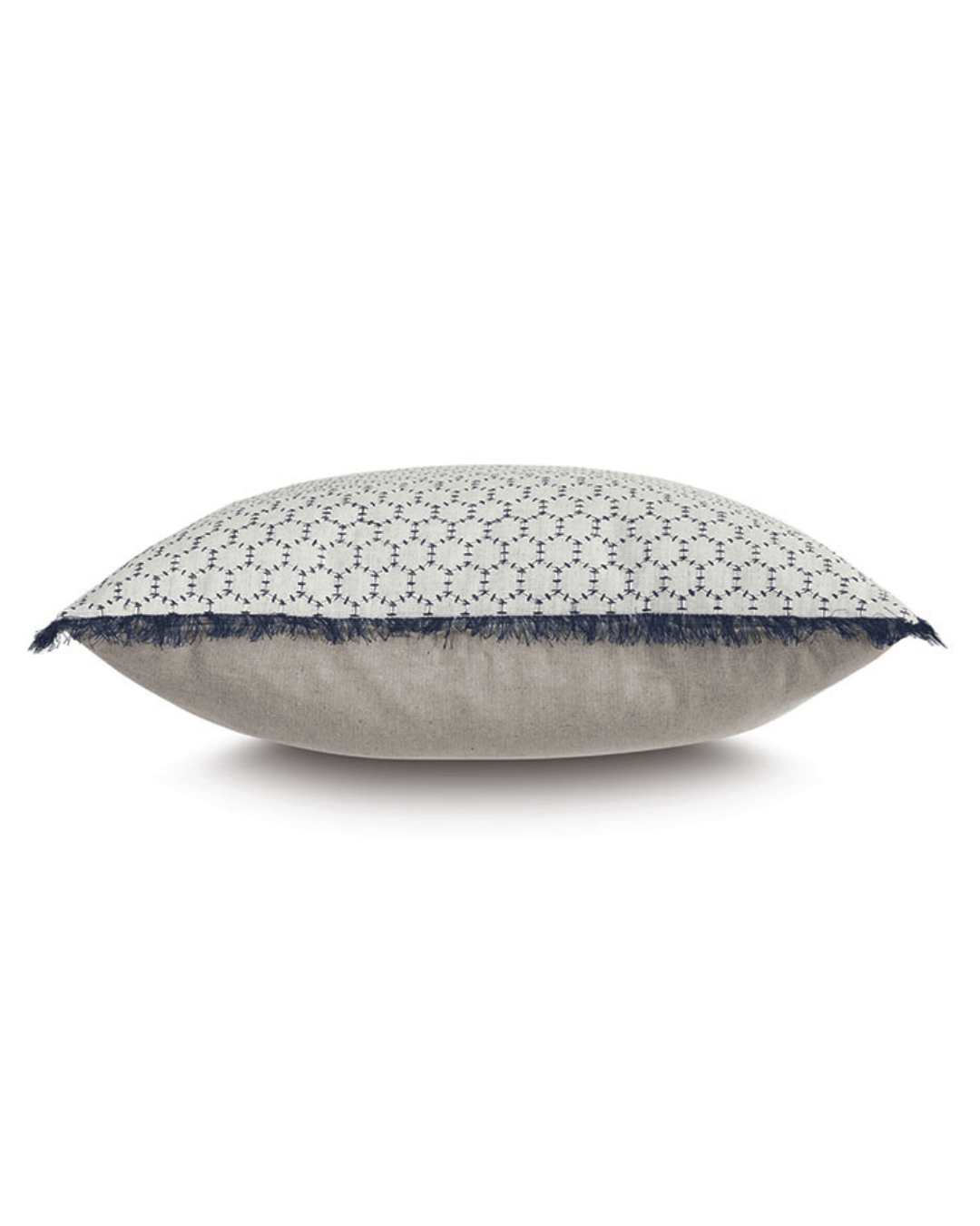 A Bea Embroidered Pillow by Eastern Accents with a geometric pattern on the top half and a solid denim-like fabric on the bottom half, set against a white background, showcasing Arizona style.