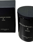 The Bulgarian Rose & Oud Mini Candle (2.4 oz) by European Scents LLC features a luxury fragrance in a black jar with wooden lid, elegantly packaged in a matching box.