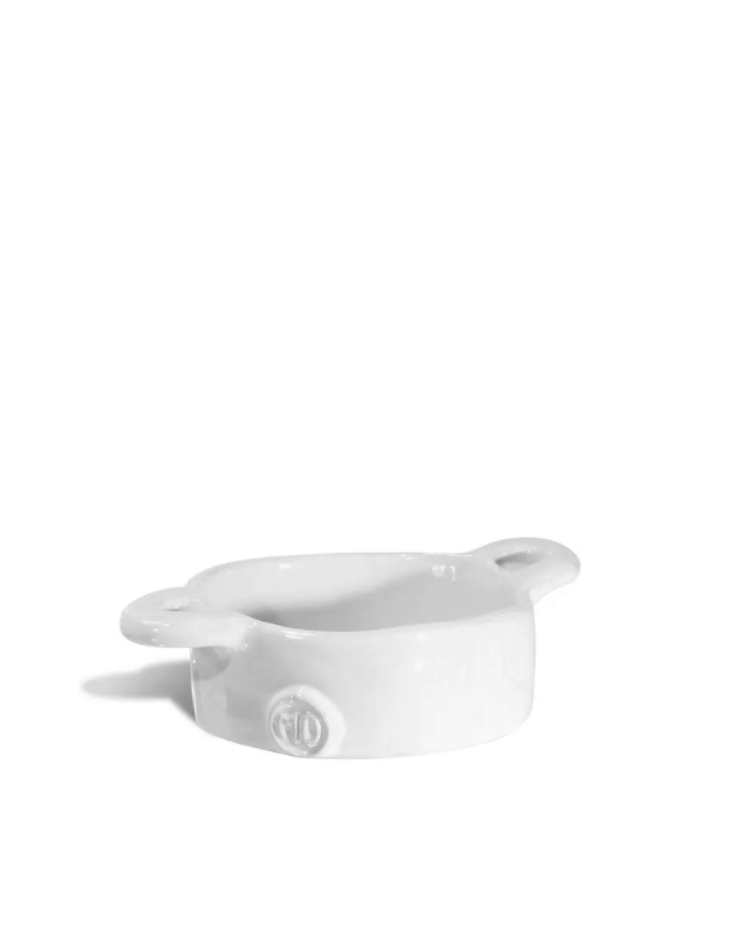 White ceramic ramekin with handles, displayed on a plain background in a Scottsdale Arizona bungalow. (Bowl No. 5 by Montes Doggett)