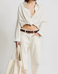 Denimist Twisted Front Shirt and pants set with matching tote bag, styled against a white background.