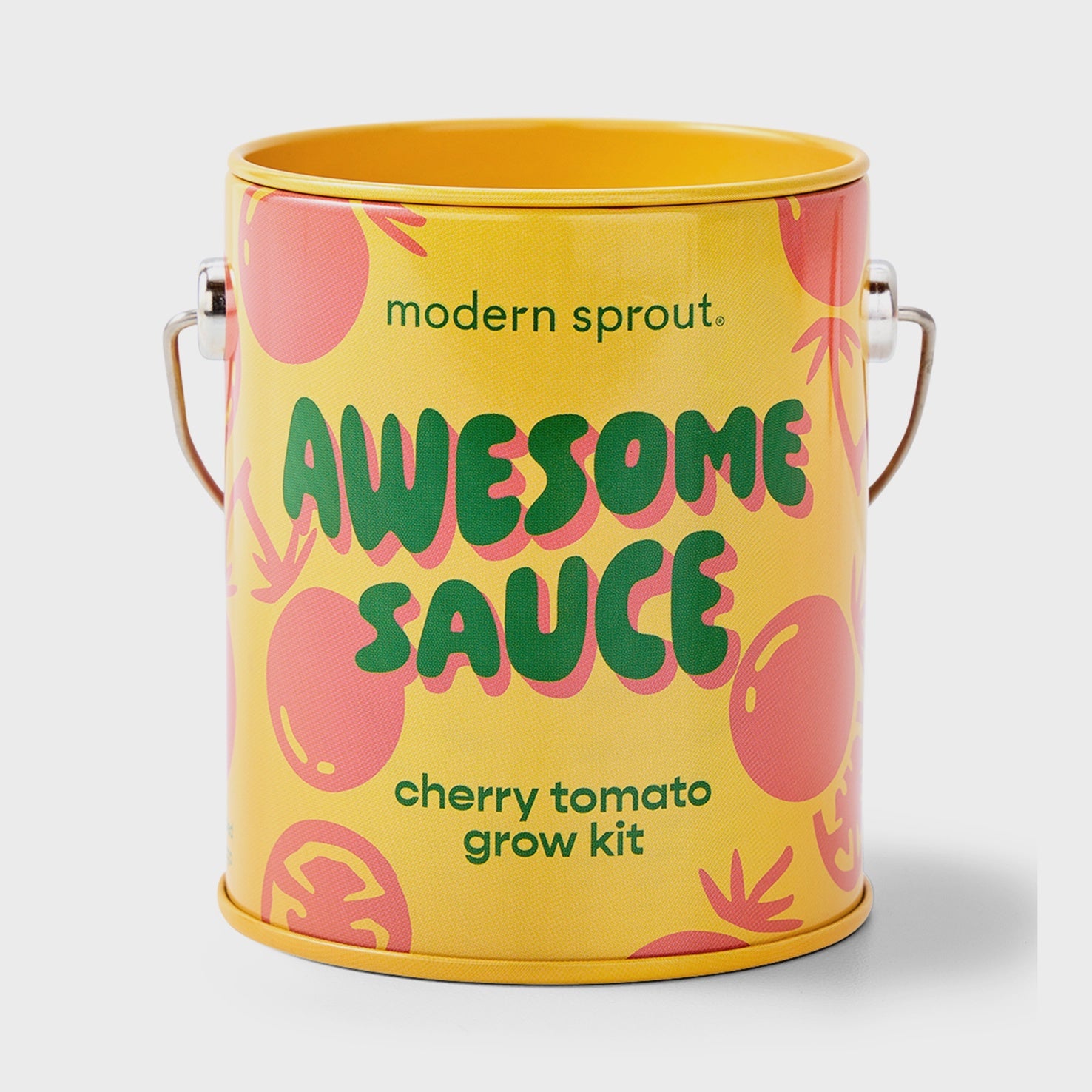 This playful yellow and red tin by Faire, named "Awesome Sauce," features bold text, cheerful tomato illustrations, and side handles for easy planting with this cherry tomato grow kit.