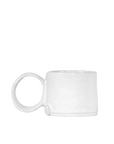 A Montes Doggett Espresso Cup No. 926 with a cylindrical shape and large, rounded handle, positioned against an all-white background in a Scottsdale, Arizona bungalow.
