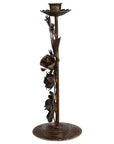 The HomArt Floral Taper Holder is a tall, bronze metal candleholder with handcrafted floral details on the stem and a round base—perfect for adding old world charm to any space.