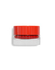 Faire's 03 Tinted Lip Balm & Blush is shown in a small clear glass jar with a bright red lid, featuring a tinted formula that moisturizes lips and can be used as blush, set against a white background.
