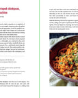 An open Smitten Kitchen Every Day cookbook by Random House displays a vivid carrot salad with tahini, crispy chickpeas, and pistachios; the left page features easy recipes, while the right shows a herb- and nut-garnished salad bowl.