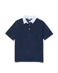 The Kule Terry Polo is a sporty, chic short-sleeve navy blue cotton terry shirt with a white collar and two-button placket, displayed flat on a white background.