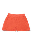 The Terry Venus short by Kule, in bright orange cotton-blend terry, features an elastic waist and front pockets. Shown laid flat on a white background.