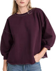 Rachel Comey Fond Sweatshirt in plum with raw hem, styled casually with blue jeans.