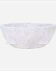 The Import Collection's Primley Bowl showcases a white textured stone design with a rounded shape and smooth rim, set against a plain white background.