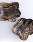 Mexican onyx bowls with brown and beige stripes by Faire, perfect for decorative accent or serving.