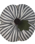 The Faire Pumpkin features black and white vertical stripes, a brown stem, and a green felt leaf—ideal as farmhouse decor or a charming autumn ornament.