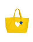 Sunshine yellow tote with white heart print and blue leather charm by Kerri Rosenthal, Imperfect Heart collection.