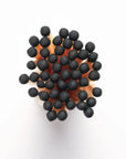 A close-up, top-down view of Faire’s Fireplaces Apothecary Matches shows their black match heads clustered together against a white background.
