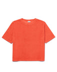 The Terry Hurley by Kule is a bright orange, short-sleeved cotton-blend t-shirt with a roomy fit, shown laid flat on a white background.
