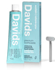 A tube of Faire Davids Toothpaste with its box and a recyclable metal tube key. The whitening, antiplaque formula is fluoride free, sulfate free, USDA certified biobased, and comes in natural spearmint flavor for fresh breath.