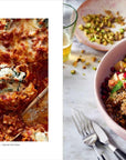 A partly served cheesy spinach lasagna sits in a baking dish, next to a grain salad with apples, pomegranate seeds, herbs, and chopped pistachios—from “You Got This” by Simon & Schuster Inc.