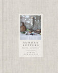 The cover of Sunday Suppers by Random House displays rustic kitchen items, bread, eggs, and garlic on a textured backdrop, perfectly mirroring the book’s seasonally inspired recipes and gatherings.