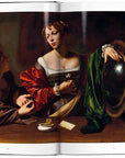 A page from "Caravaggio. The Complete Works" by Ingram Book Company displays two women at a table—one gesturing passionately, the other holding a mirror—bathed in dramatic light amid rich fabrics and muted colors.