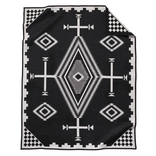 The Jacquard Robe by Pendleton/Babbitt's Wholesale features a Native American-inspired black and white geometric wool pattern with diamonds, zigzags, crosses, and checkerboard accents in a soft woven texture.