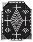The Jacquard Robe by Pendleton/Babbitt's Wholesale features a Native American-inspired black and white geometric wool pattern with diamonds, zigzags, crosses, and checkerboard accents in a soft woven texture.