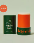 An orange and green tube of "The Everywhere Stick" by Faire with its cap off reveals the wax-free formula. A "NEW IN" label is on display, and the packaging boasts bold, modern text, infused with plant butters.