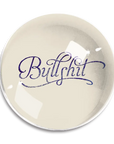 The Dome Crystal Paperweight by Ben's Garden, handcrafted in a New York studio, features the word "Bullshit" elegantly written in cursive blue lettering at its center.
