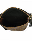 Open view of the Faire Britt Belt Bag in black leather, featuring gold zipper and hardware, black interior, tassel detail, and a monogram exterior that blends sustainable luxury with timeless style.