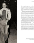 A black-and-white photo on a page of "Ralph Lauren In His Own Fashion" by Hachette Book Group shows a smiling man and woman walking arm in arm at night, with the opposite page featuring an article titled "Menswear.