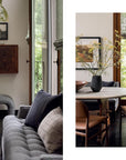Bring nature inside with "Outside In" by Gibbs Smith Publisher—a modern dining room featuring a wooden table, leather chairs, gray sofa, and tall windows showcasing greenery, paired with minimalist decor and neutral-toned accents.