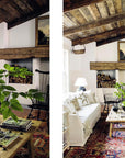 Two views of a cozy living room with wood ceilings, white sofas, a patterned rug, fireplace, and large plant on the coffee table embody the relaxed Down to Earth style by Hachette Book Group, inspired by Lauren Liess’s interiors.
