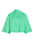 The PIXIE Shirt by Cissa is a bright green, cropped, short-sleeved cotton poplin shirt with a boxy silhouette and chest pocket, shown buttoned up and laid flat on a white background.