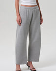 Heather grey Miro Sweatpant by Citizens Of Humanity/AGOLDE styled with a white top and black heeled sandals.