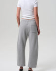Heather grey Citizens Of Humanity Miro Sweatpant styled with a white tee and black heeled sandals, shown from the back.