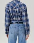 Back view of vintage plaid button-up shirt in blue marina by Citizens of Humanity against a plain background.