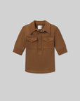 The Amina Polo Shirt by Citizens Of Humanity/AGOLDE features long sleeves, brown ribbed cotton, a wide collar, two front flap pockets, and a partial button placket, shown laid flat on a light gray background.