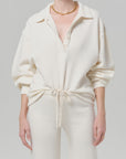 Off-white collared top and matching high-waisted wide-leg pants by Citizens Of Humanity/AGOLDE, vintage style set.