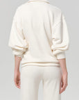 Back view of vintage Citizens Of Humanity polo and pants with cozy brushed interior, casual style.