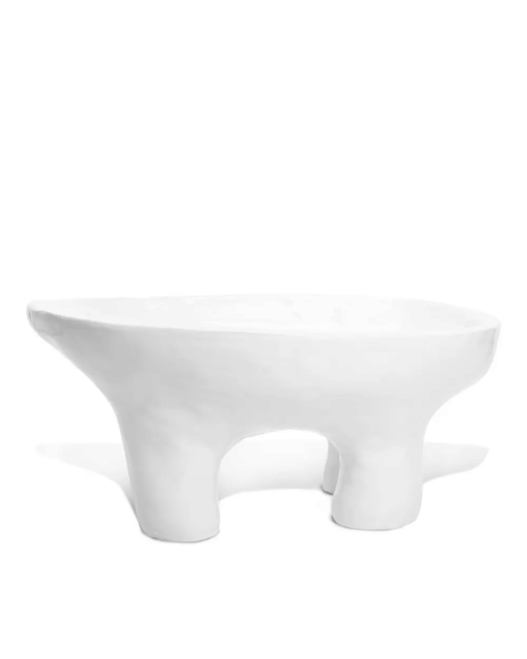 A minimalist white coffee table with a unique, asymmetrical, three-legged design, isolated on a plain white background, perfect for a bungalow in Scottsdale Arizona by Montes Doggett&#39;s Bowl No. 846.