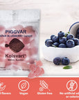 A bag of Faire Piggvar Candy Fish sits beside a tipped cup spilling fresh blueberries. Text highlights these Swedish fish are vegan, gluten-free, made with natural flavors, and contain no artificial additives.