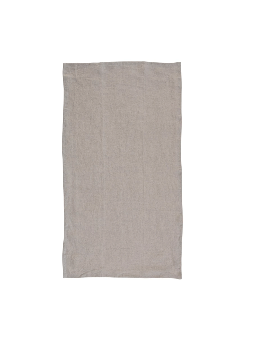 A plain beige oversized stonewashed linen tea towel natural laid flat on a white background in a Scottsdale, Arizona bungalow by Creative Co-op.