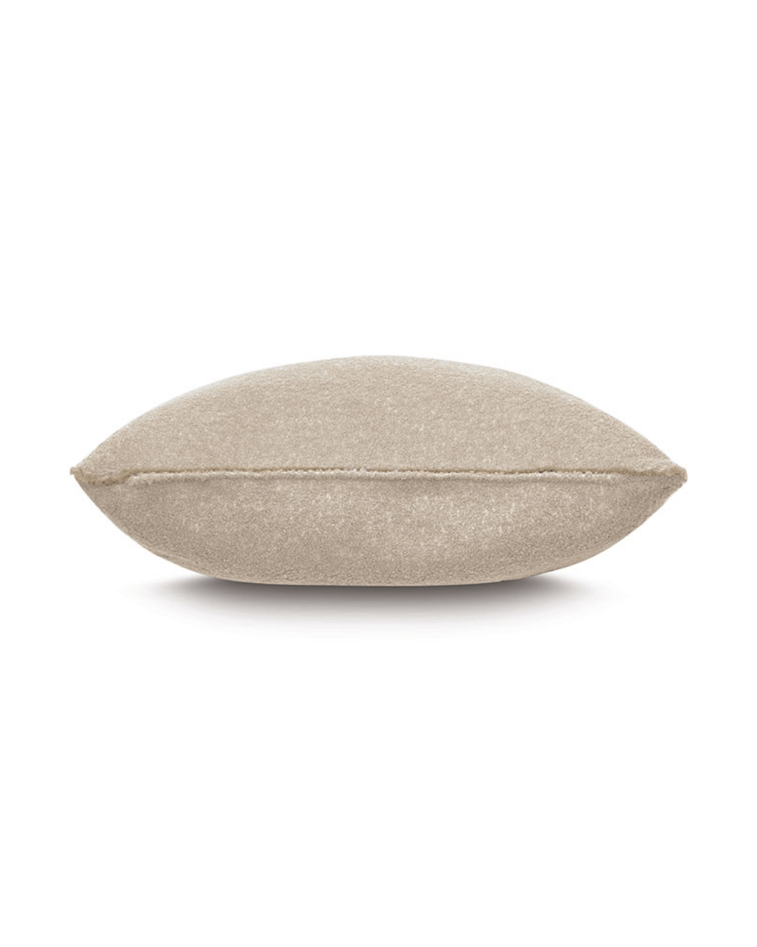 A plain beige decorative Boucle Camel Pillow from Eastern Accents with a subtle textured fabric and visible seams, evoking the comfort of a Scottsdale Arizona bungalow, isolated on a white background.