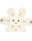 Meet the Amuseable Snowflake by Jelly Cat Inc.—a plush snowflake with a smiling face, black button eyes, gray mittened arms, and silver embroidered details, perfect for adding sparkle to your collection!.
