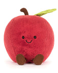 A Jelly Cat Inc. Amuseables Apple plush toy features a red apple shape with a brown stem, green leaf, small brown feet, and a smiling face with black eyes, sitting upright against a white background.