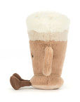 The Amuseables Latte plush toy by Jelly Cat Inc. features a beige mug design with a handle, fluffy white "latte art" top, and soft brown feet—perfect for cozy fun.